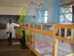 Mosquito nets benig used in
                  Gihogwe School dormitory